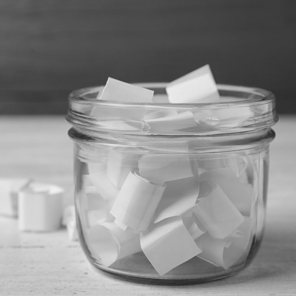 A jar filled with paper