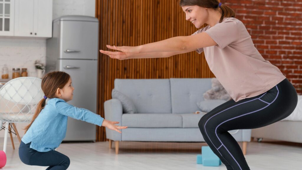 A MOTHER AND CHILD EXERCISING TOGETHER AT HOME